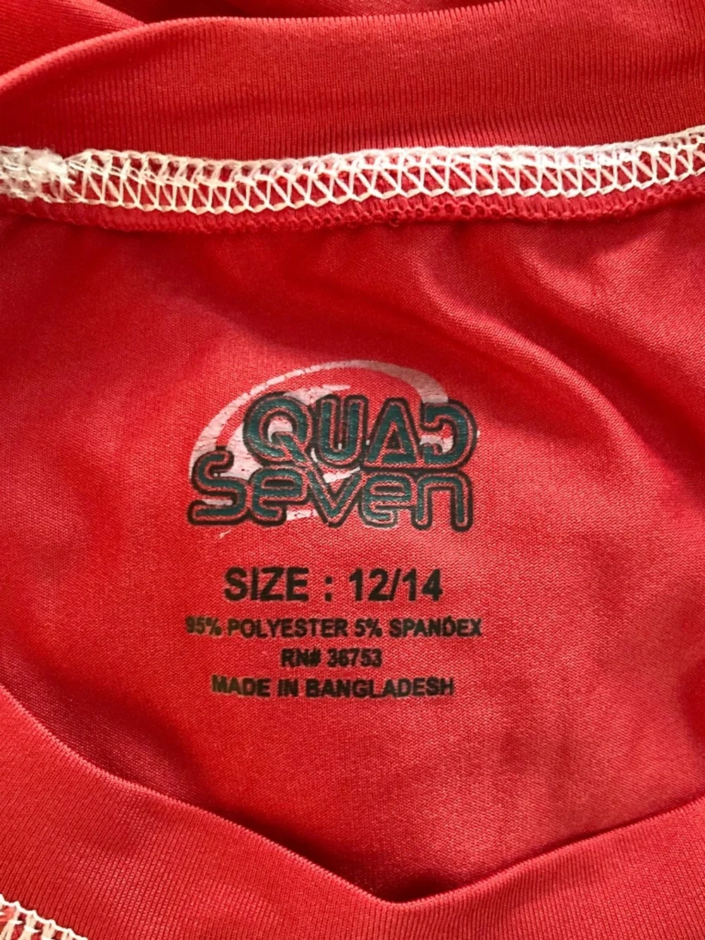 Boy’s size 12/14 Quad Seven long sleeved red swim shirt/rash guard